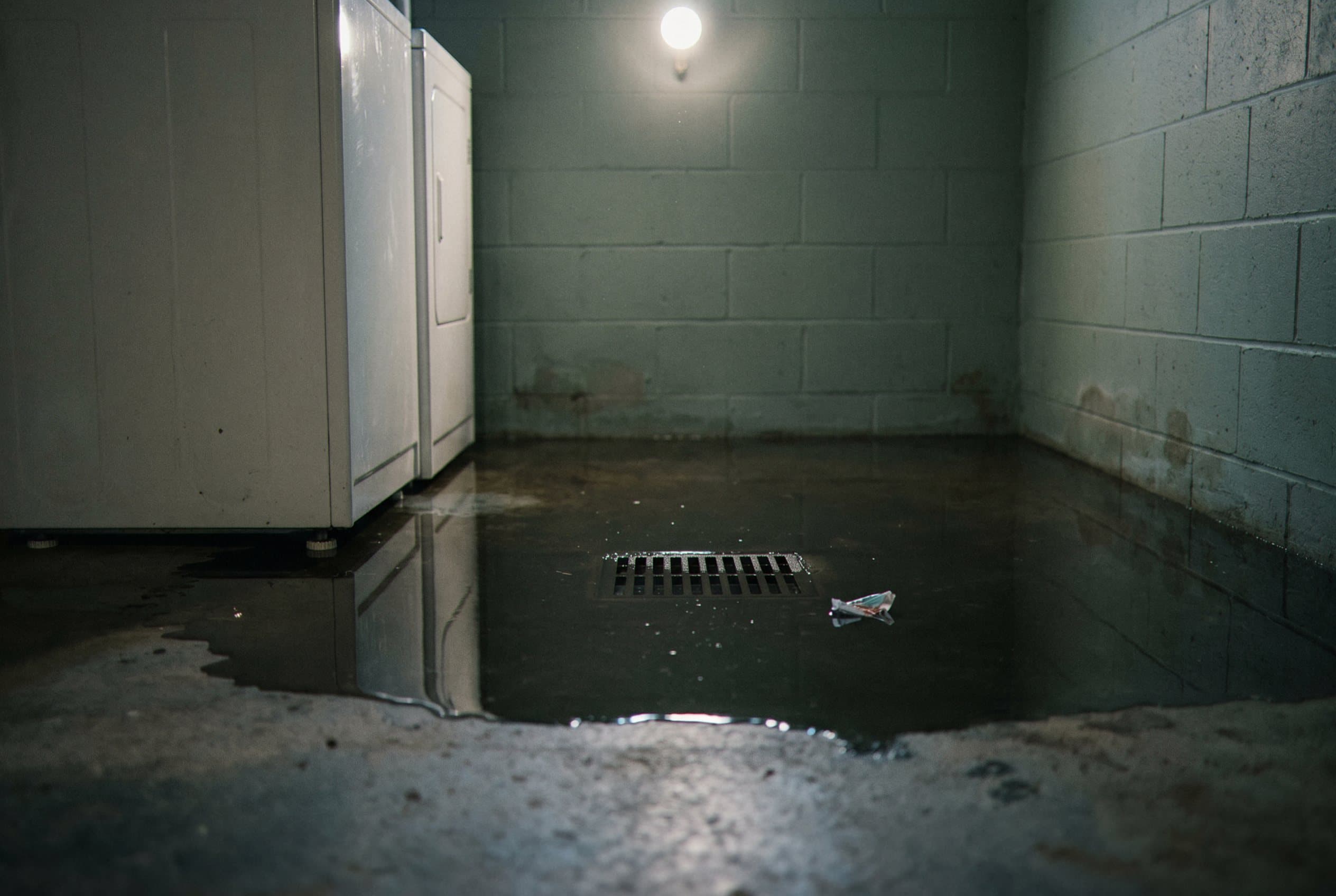 Basement floor with visible sewage contamination
